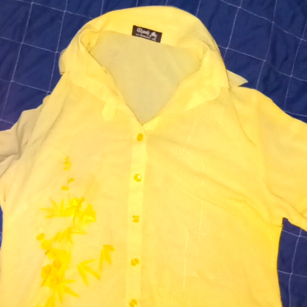 Pale yellow button-up collared shirt